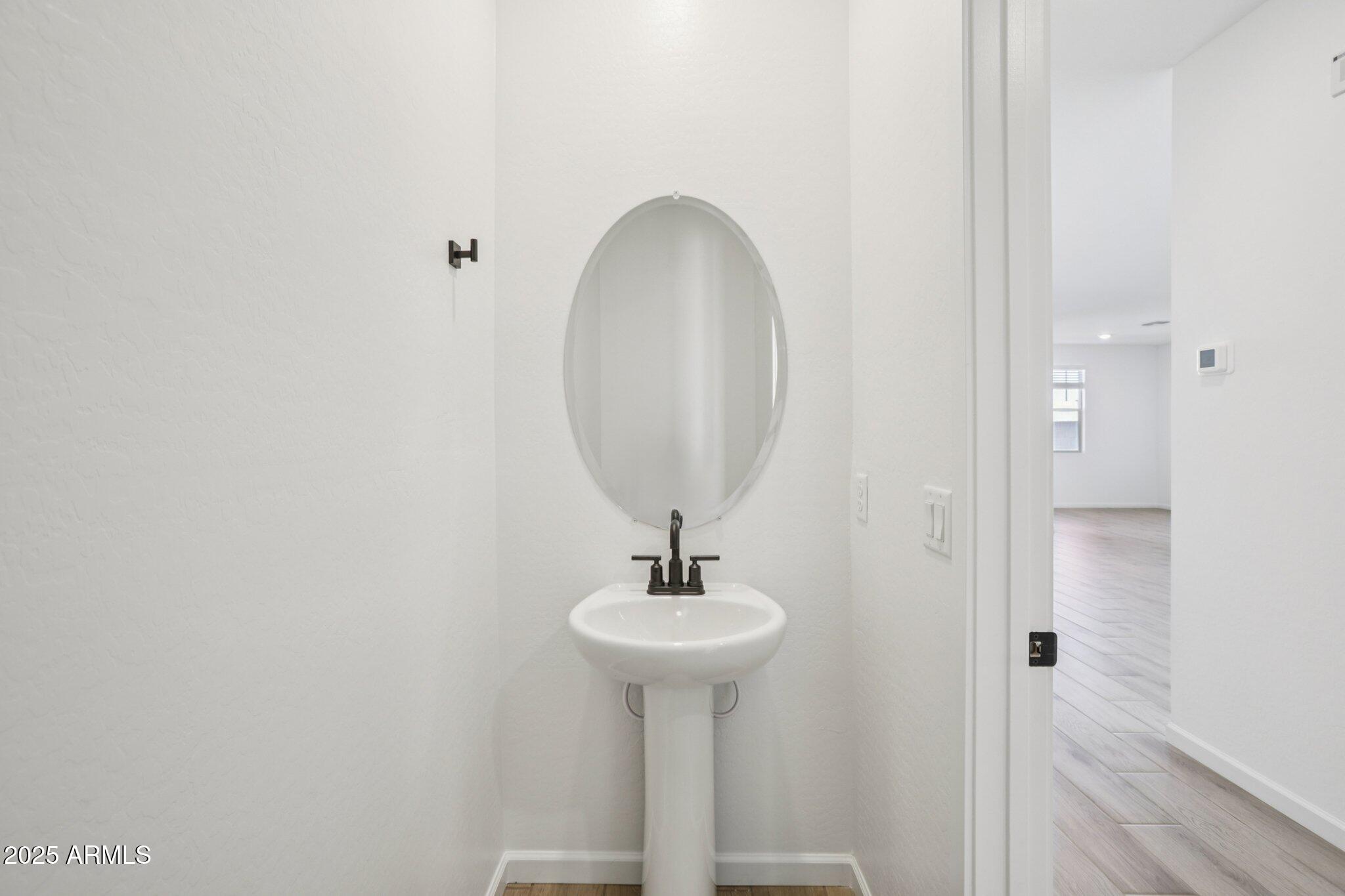 16226 West Bajada Road Surprise, AZ 85387 - Photo 16 of 45 a bathroom with a sink and a mirror