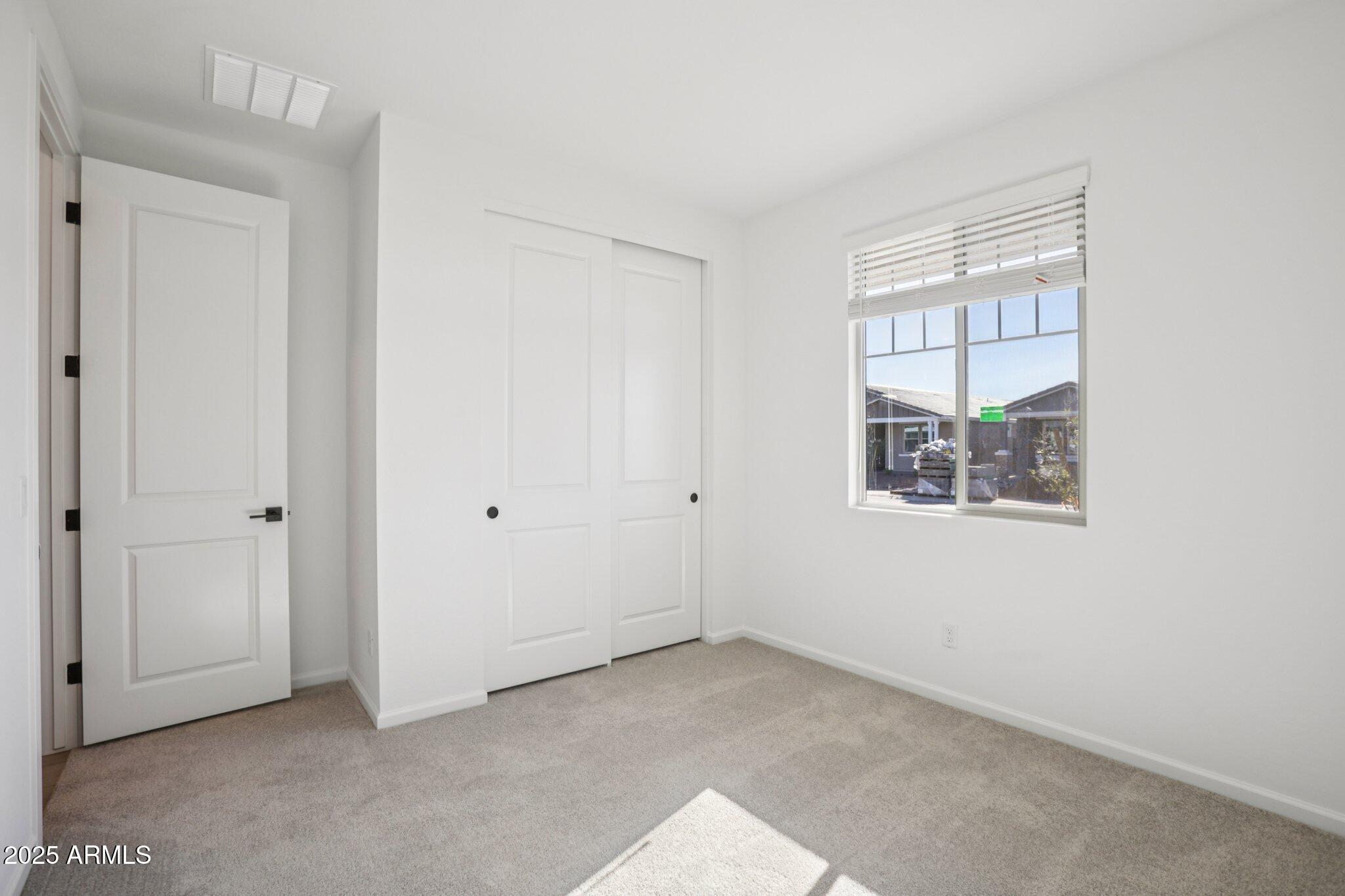16226 West Bajada Road Surprise, AZ 85387 - Photo 19 of 45 a view of an empty room with a window
