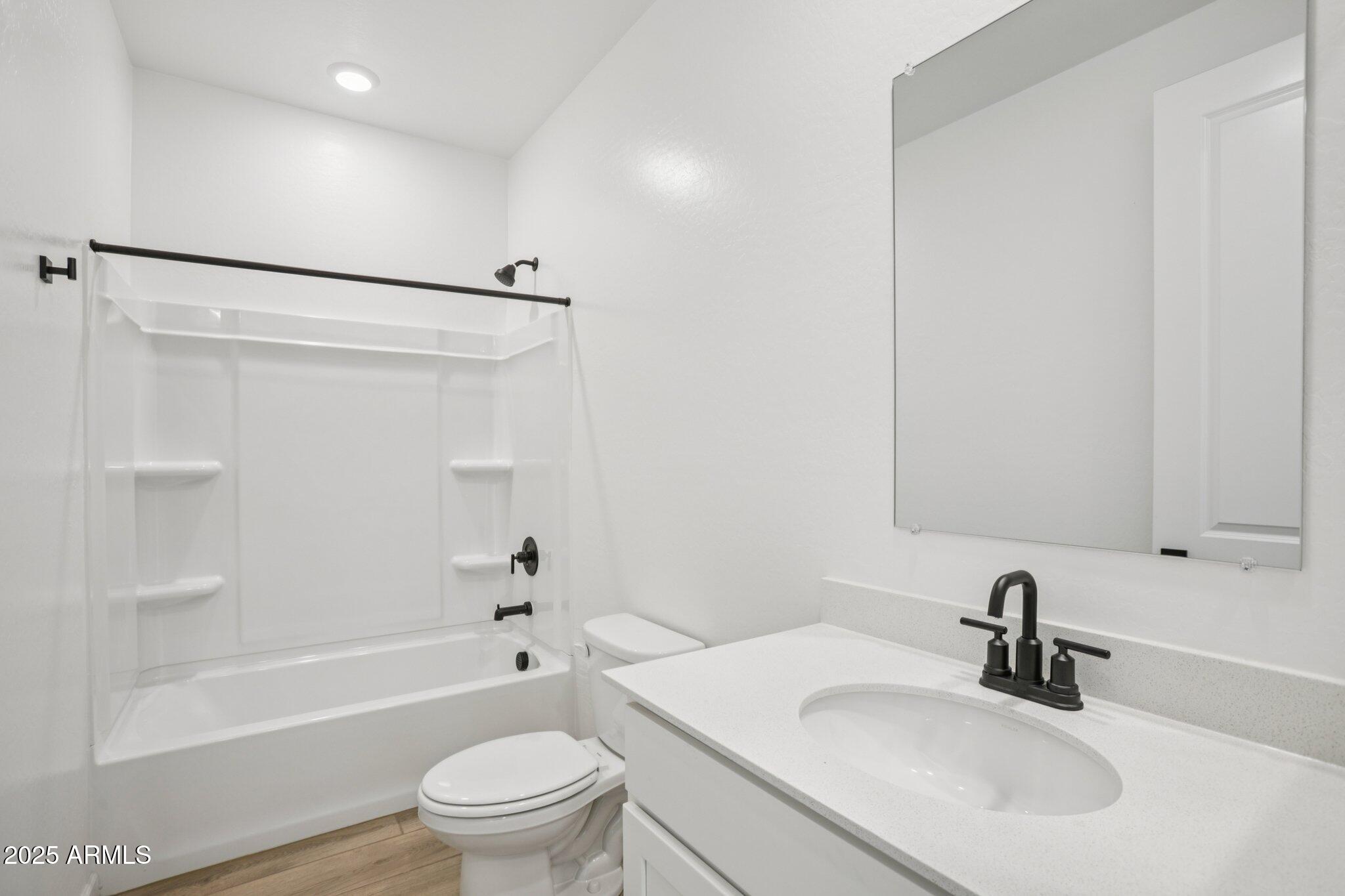 16226 West Bajada Road Surprise, AZ 85387 - Photo 20 of 45 a bathroom with a sink toilet and shower