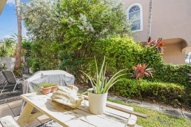 a front view of a building with garden