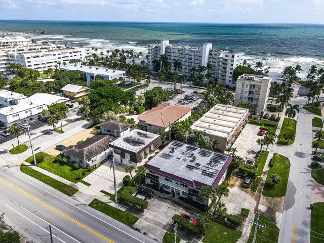 a view of a swimming pool with sitting area
