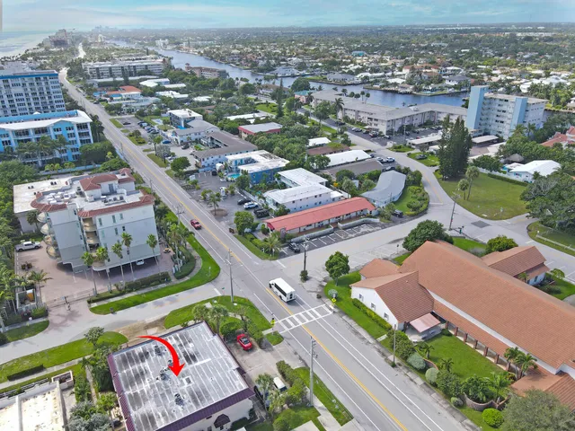 an aerial view of residential houses with outdoor space