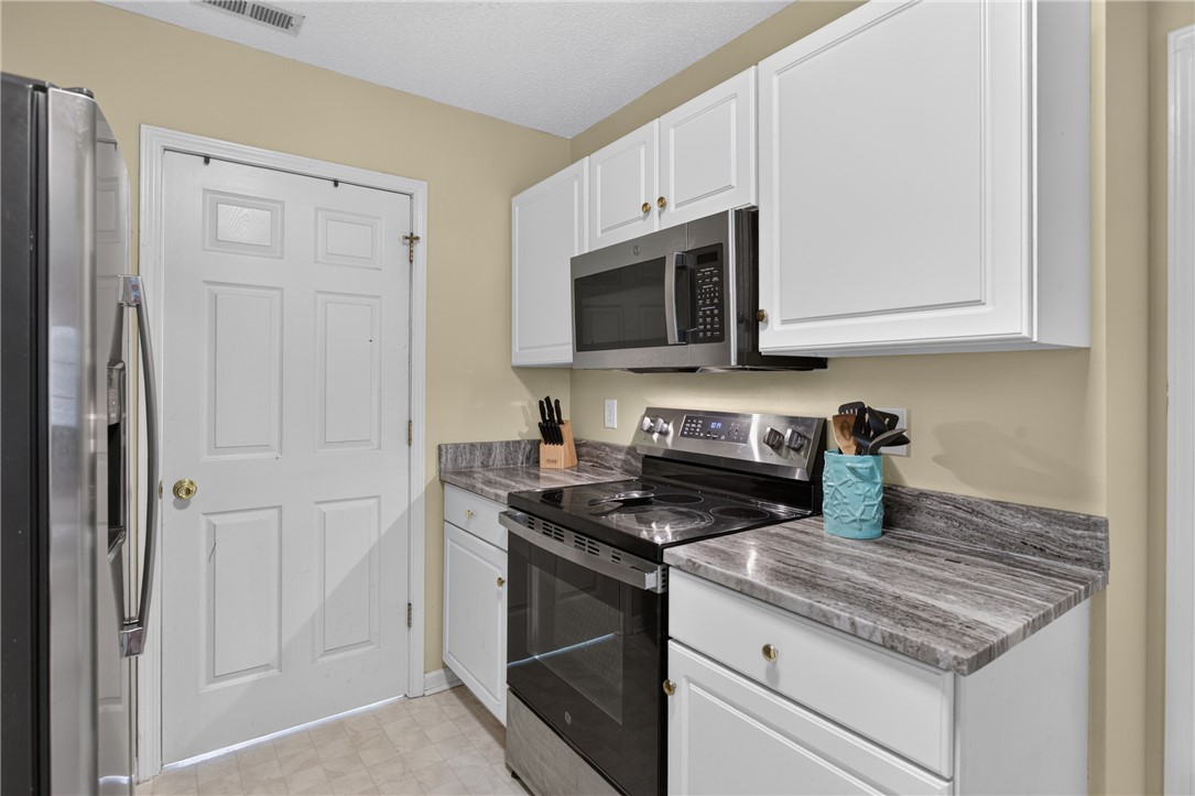 3336 Centerville Road Anderson, SC 29625 - Photo 18 of 50 A well-appointed kitchen features stainless steel appliances and ample cabinetry. Laundry room behind the closed door