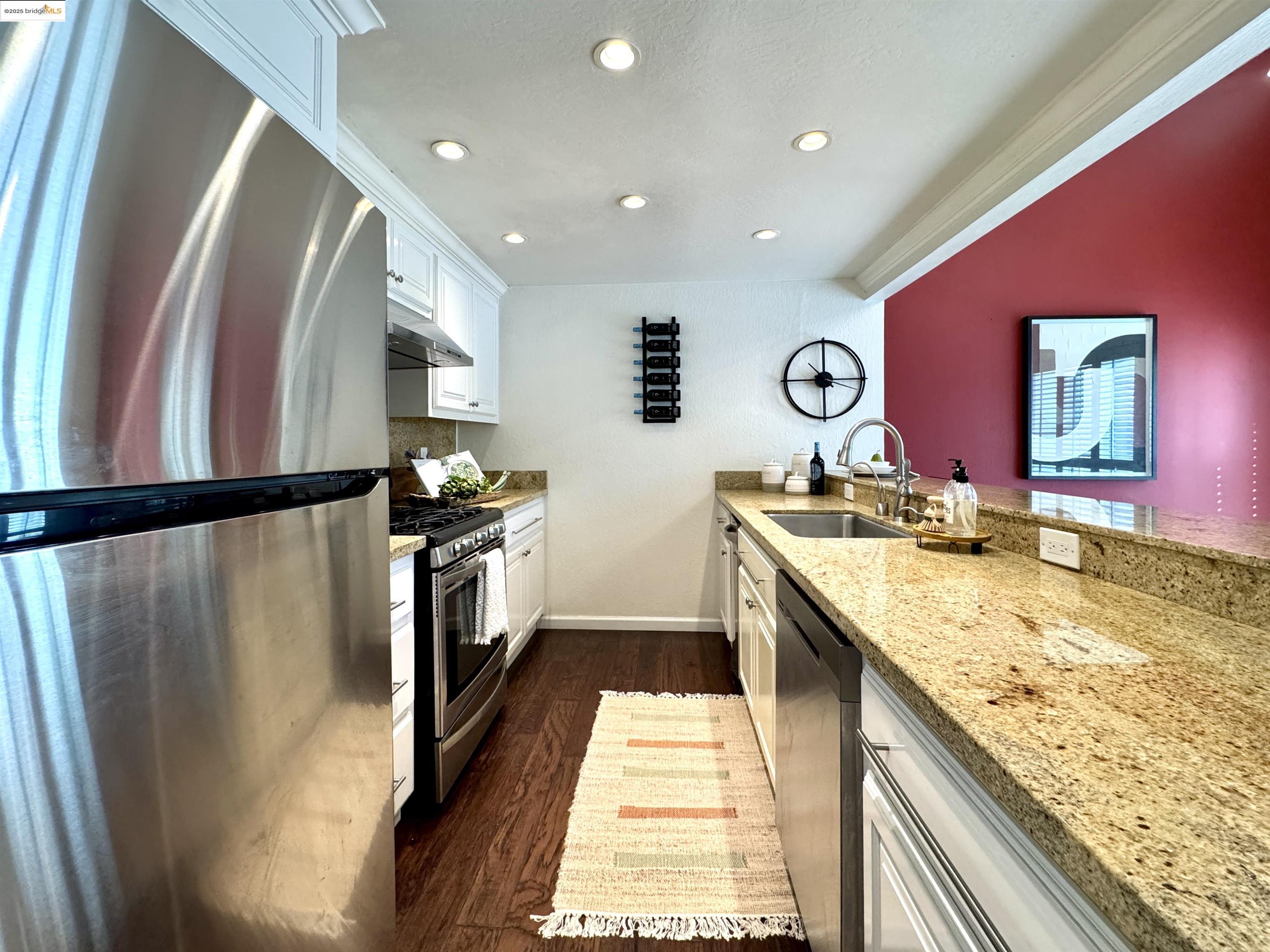 3365 Los Prados Street San Mateo, CA 94403 - Photo 11 of 47 a kitchen with stainless steel appliances granite countertop a refrigerator a stove and a sink