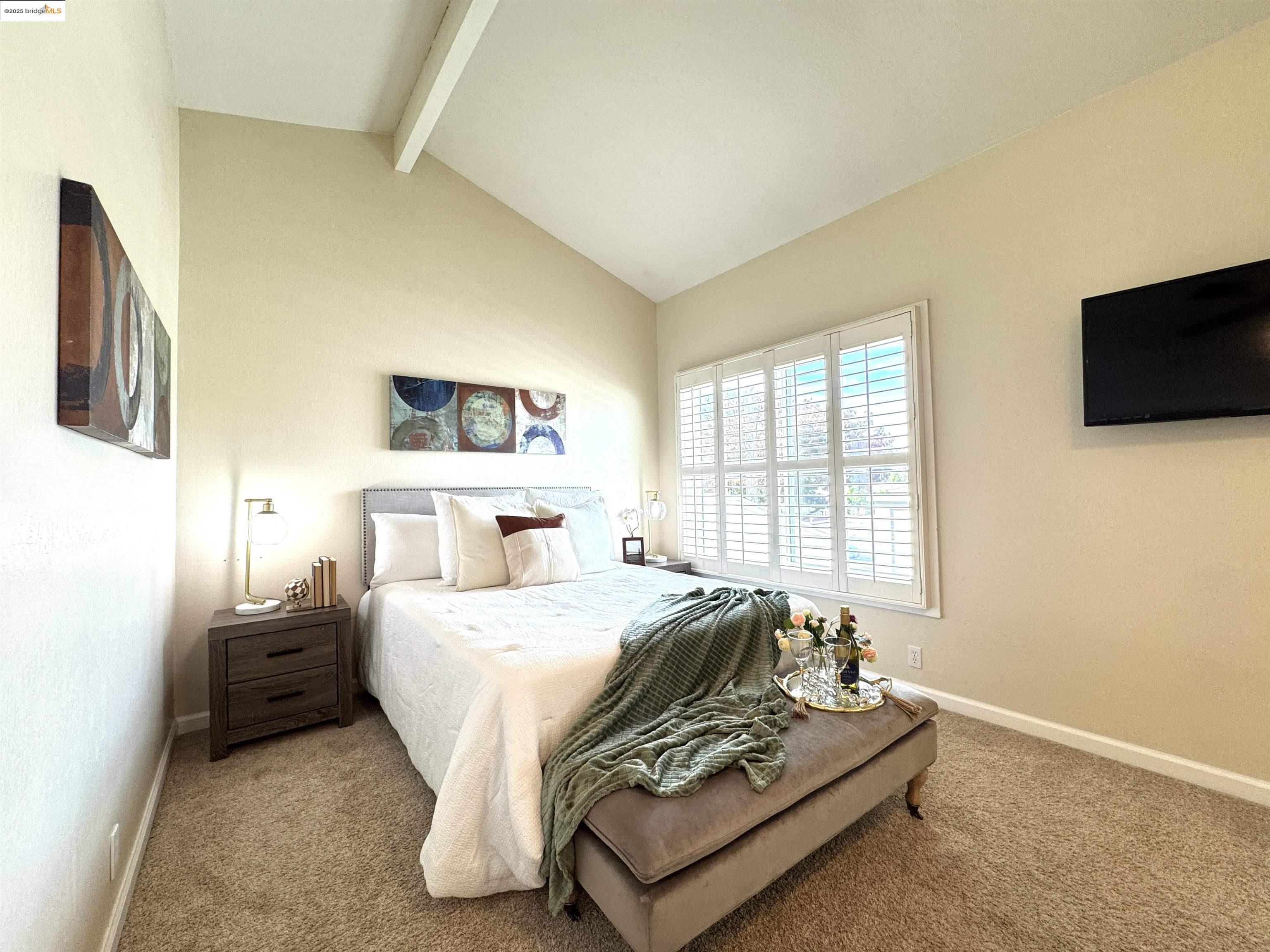 3365 Los Prados Street San Mateo, CA 94403 - Photo 19 of 47 a bedroom with a bed and a flat screen tv