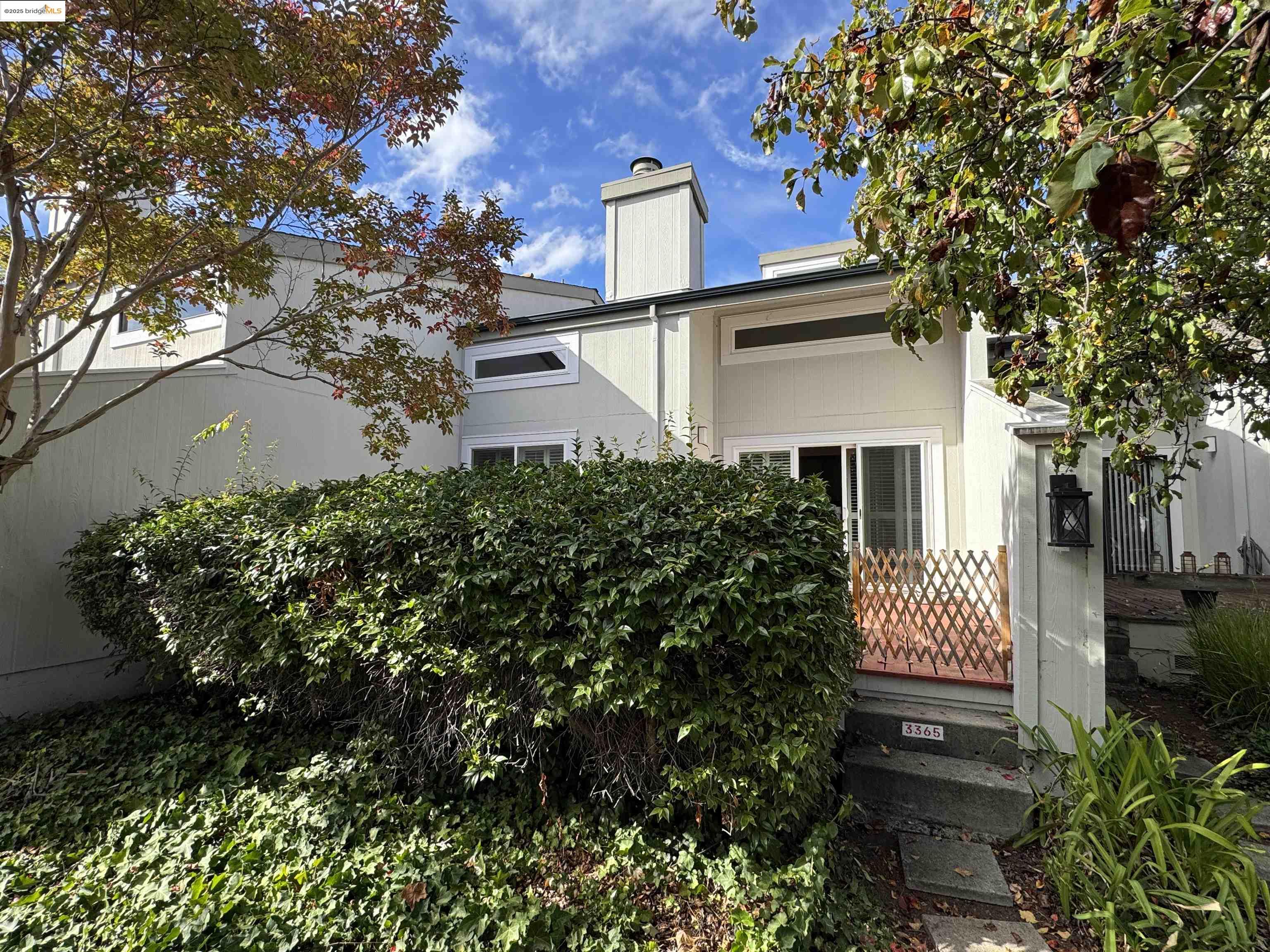 3365 Los Prados Street San Mateo, CA 94403 - Photo 32 of 47 a view of front of house with a yard