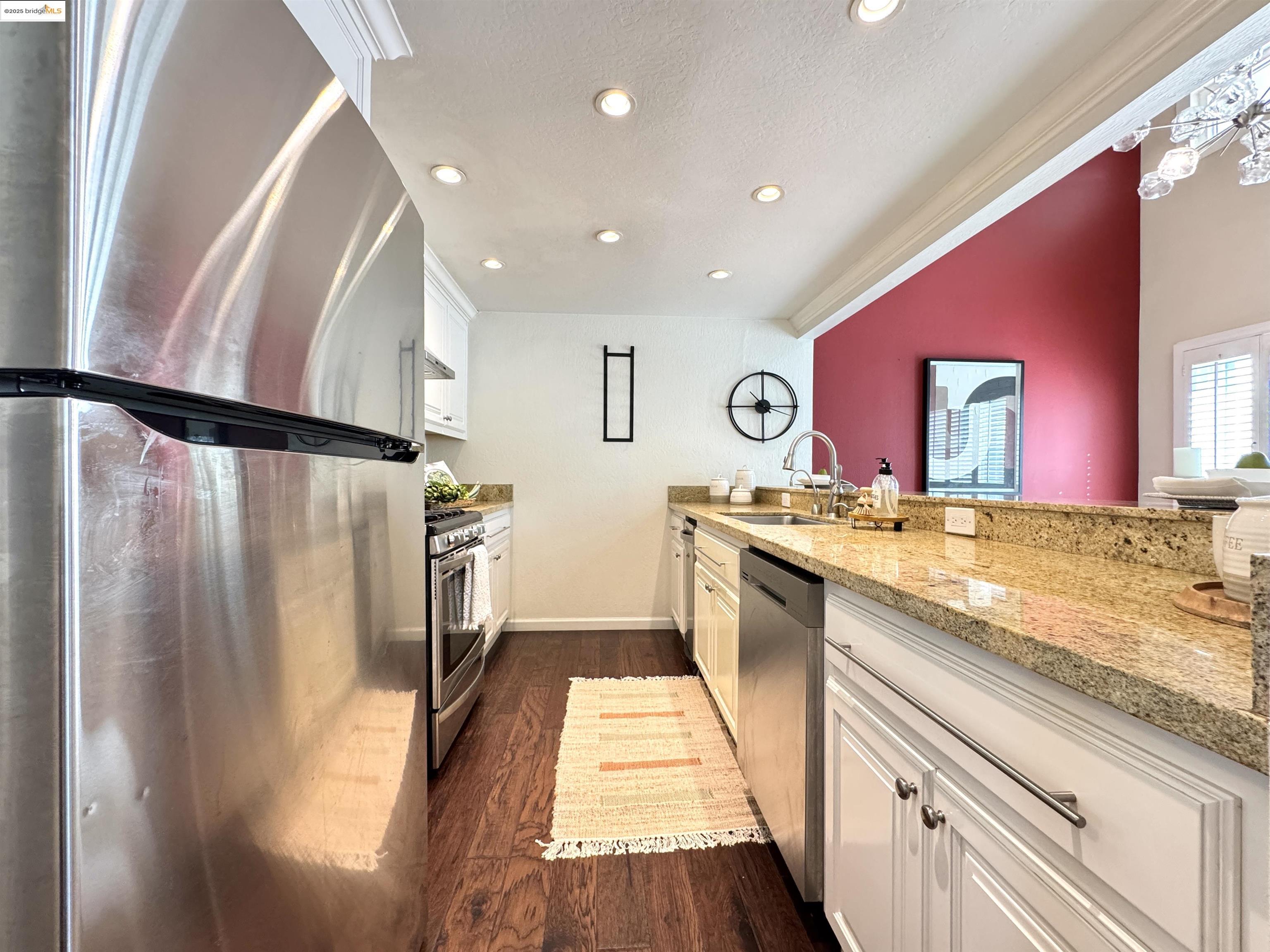 3365 Los Prados Street San Mateo, CA 94403 - Photo 8 of 47 a bathroom with a granite countertop sink and a mirror