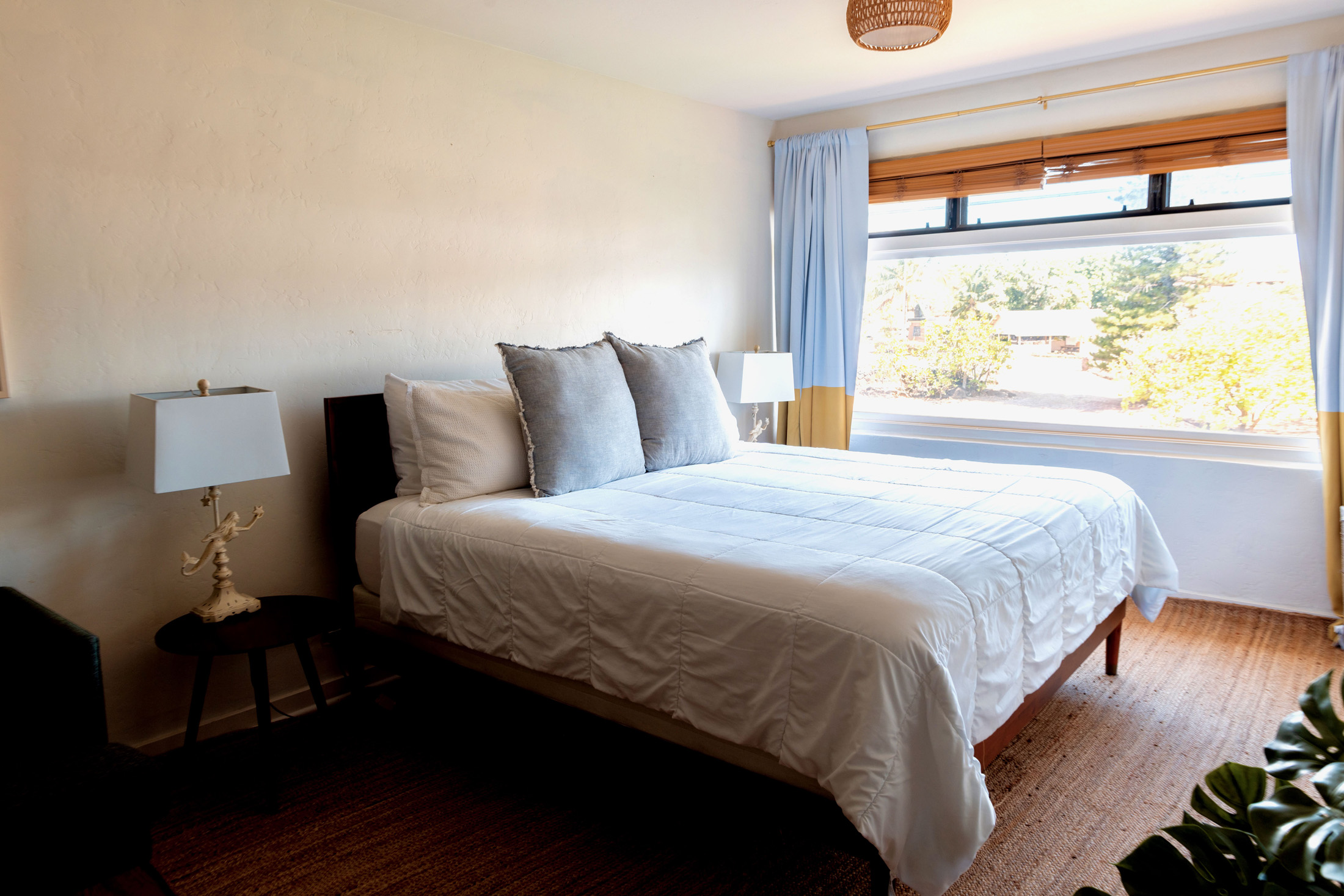 5061 Lawai Road, Unit 207 Koloa, HI 96756 - Photo 11 of 25 a bedroom with a bed and a window