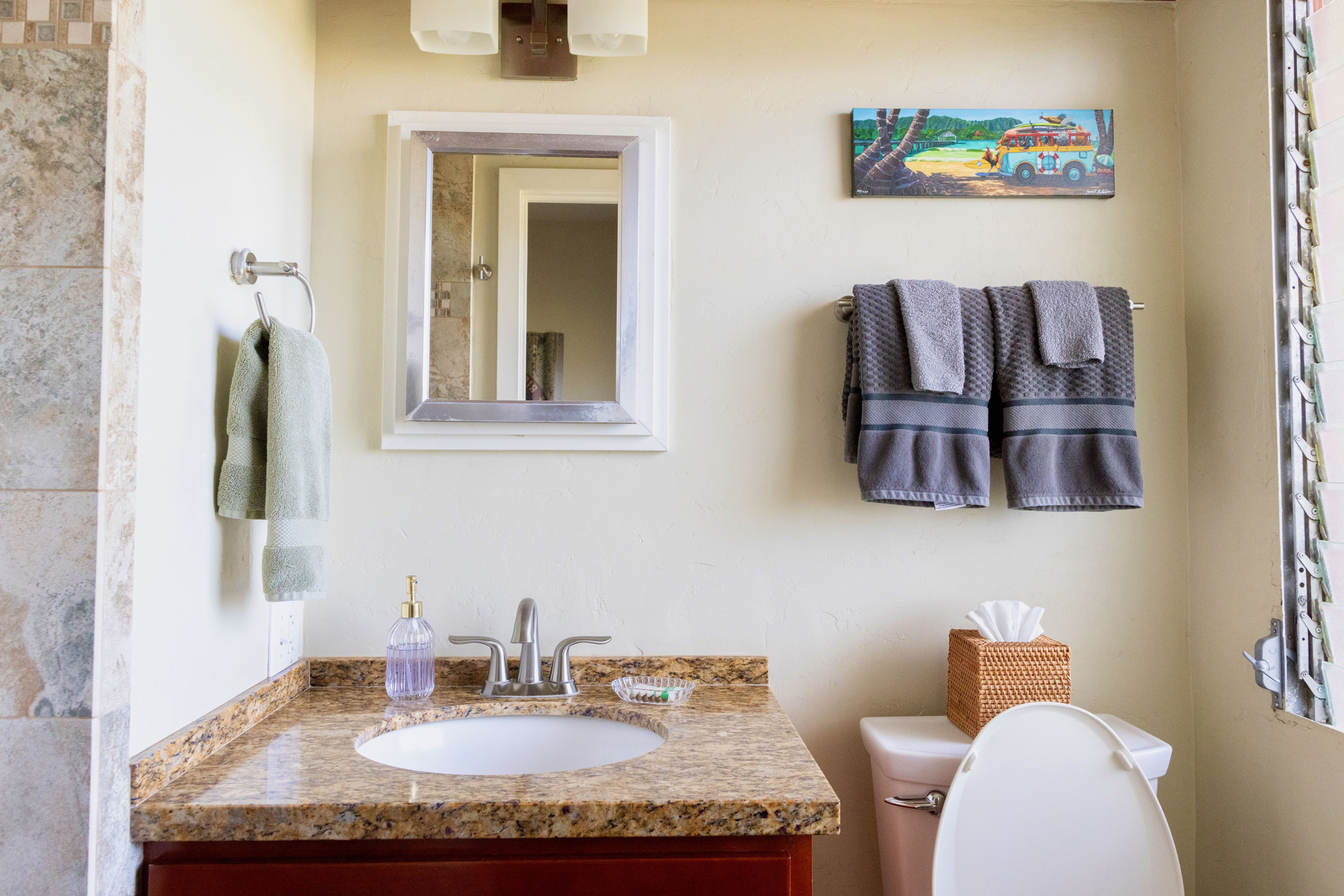 5061 Lawai Road, Unit 207 Koloa, HI 96756 - Photo 10 of 25 a bathroom with a granite countertop sink a mirror and a toilet