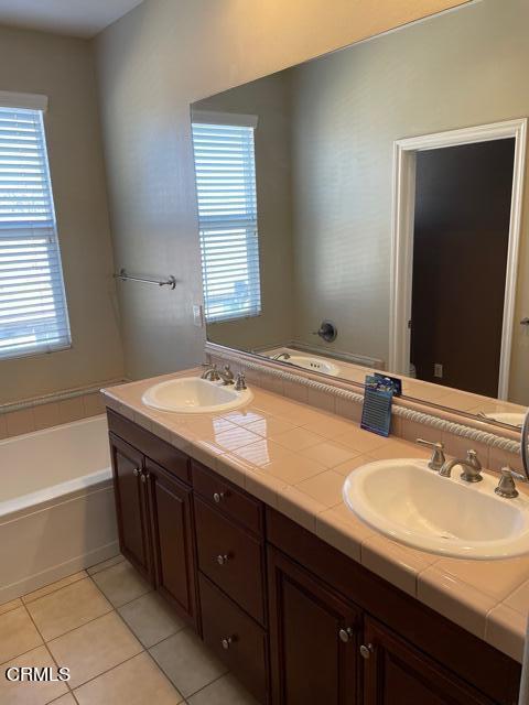 4635 Via Del Sol Camarillo, CA 93012 - Photo 14 of 16 a bathroom with a sink double vanity granite tub shower and a mirror
