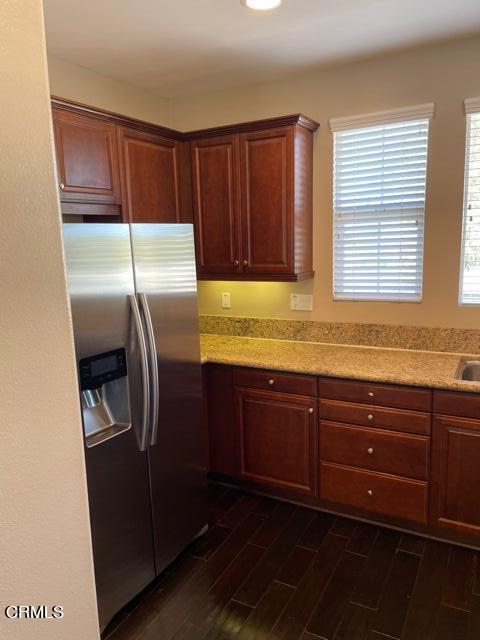 4635 Via Del Sol Camarillo, CA 93012 - Photo 4 of 16 a kitchen with granite countertop stainless steel appliances wooden cabinets a sink and a window