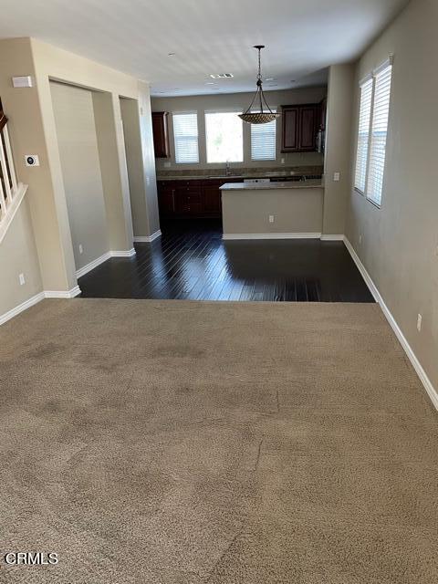 4635 Via Del Sol Camarillo, CA 93012 - Photo 5 of 16 a living room with stainless steel appliances kitchen island a flat screen tv and a fireplace