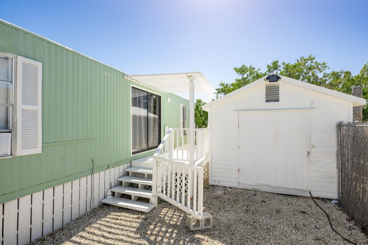 a front view of a house with stairs