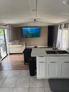 27942 Snapper Lane Summerland Key, FL 33042 - Photo 14 of 26 a kitchen with a sink and cabinets