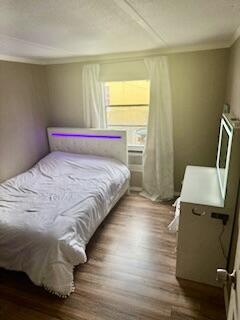 27942 Snapper Lane Summerland Key, FL 33042 - Photo 15 of 26 a bedroom with a bed and a window