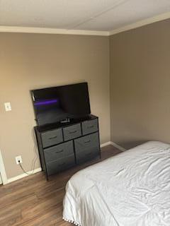 27942 Snapper Lane Summerland Key, FL 33042 - Photo 17 of 26 a bedroom with a bed and wooden floor