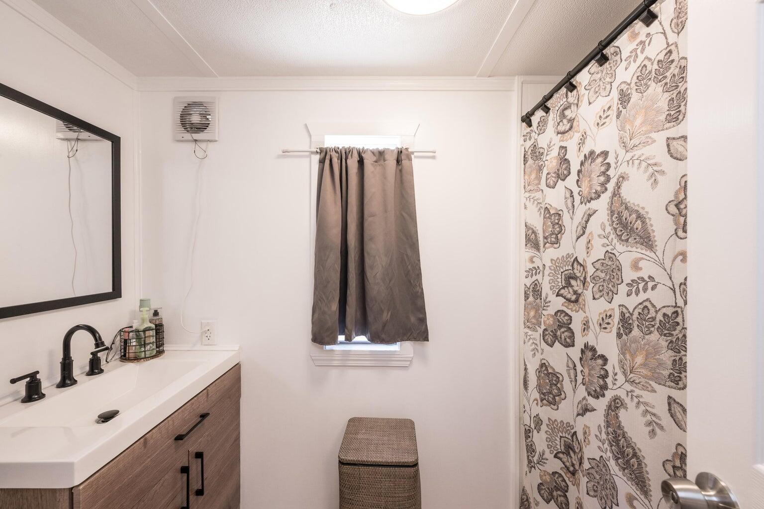 27942 Snapper Lane Summerland Key, FL 33042 - Photo 18 of 26 a bathroom with a sink and a mirror
