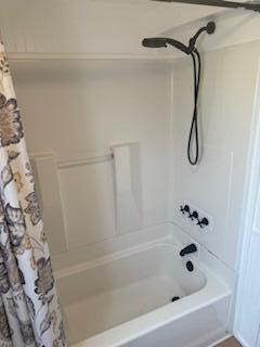27942 Snapper Lane Summerland Key, FL 33042 - Photo 20 of 26 a bathroom with a bath tub with a shower