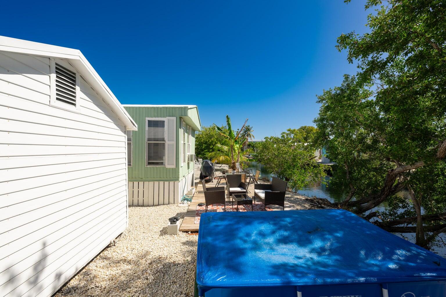 27942 Snapper Lane Summerland Key, FL 33042 - Photo 7 of 26 a backyard of a house with seating space