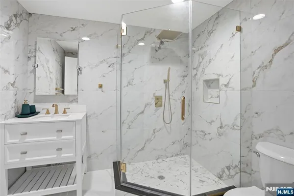 a spacious bathroom with a bathtub and shower