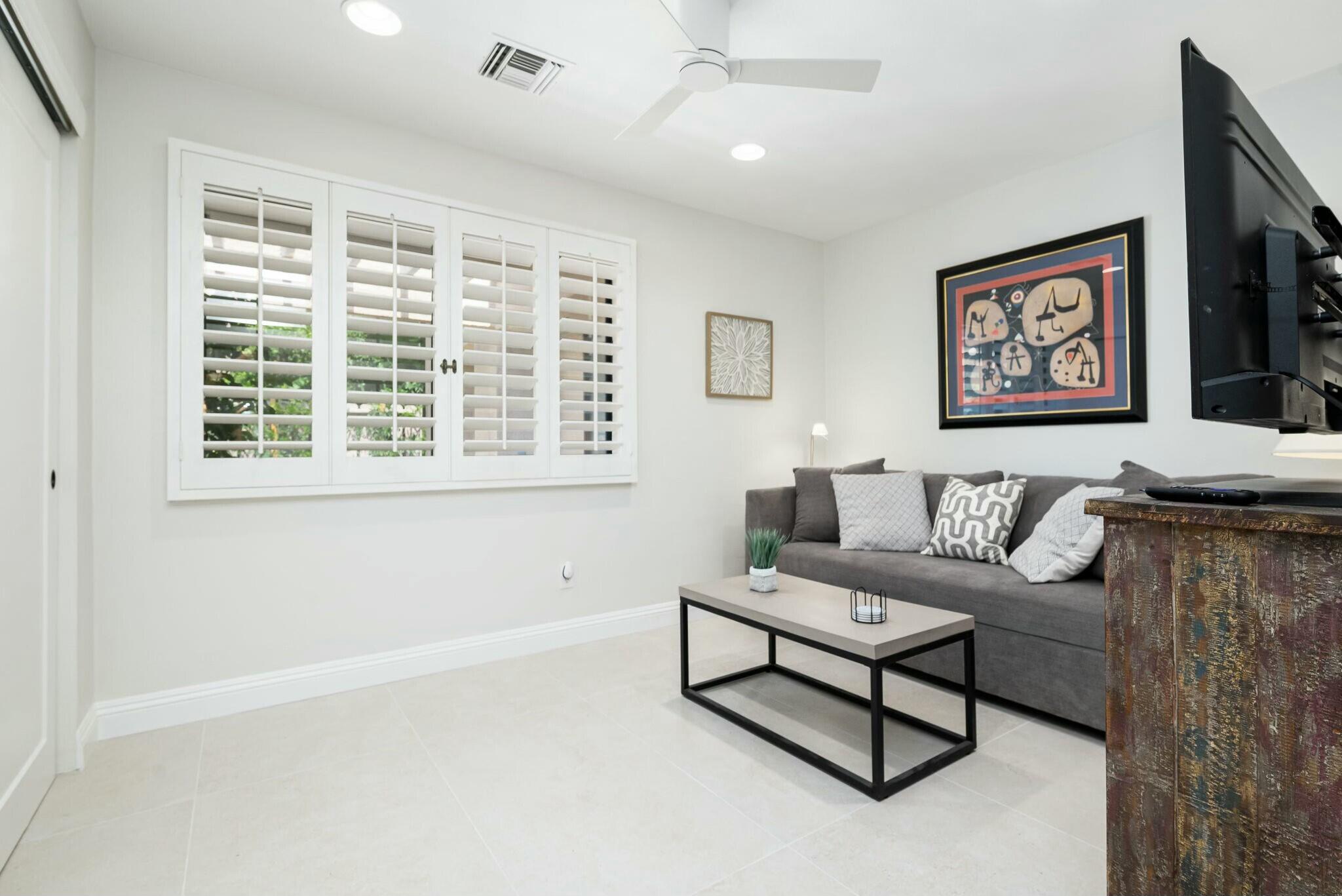 38 Mission Court Rancho Mirage, CA 92270 - Photo 55 of 61 a living room with furniture and a window