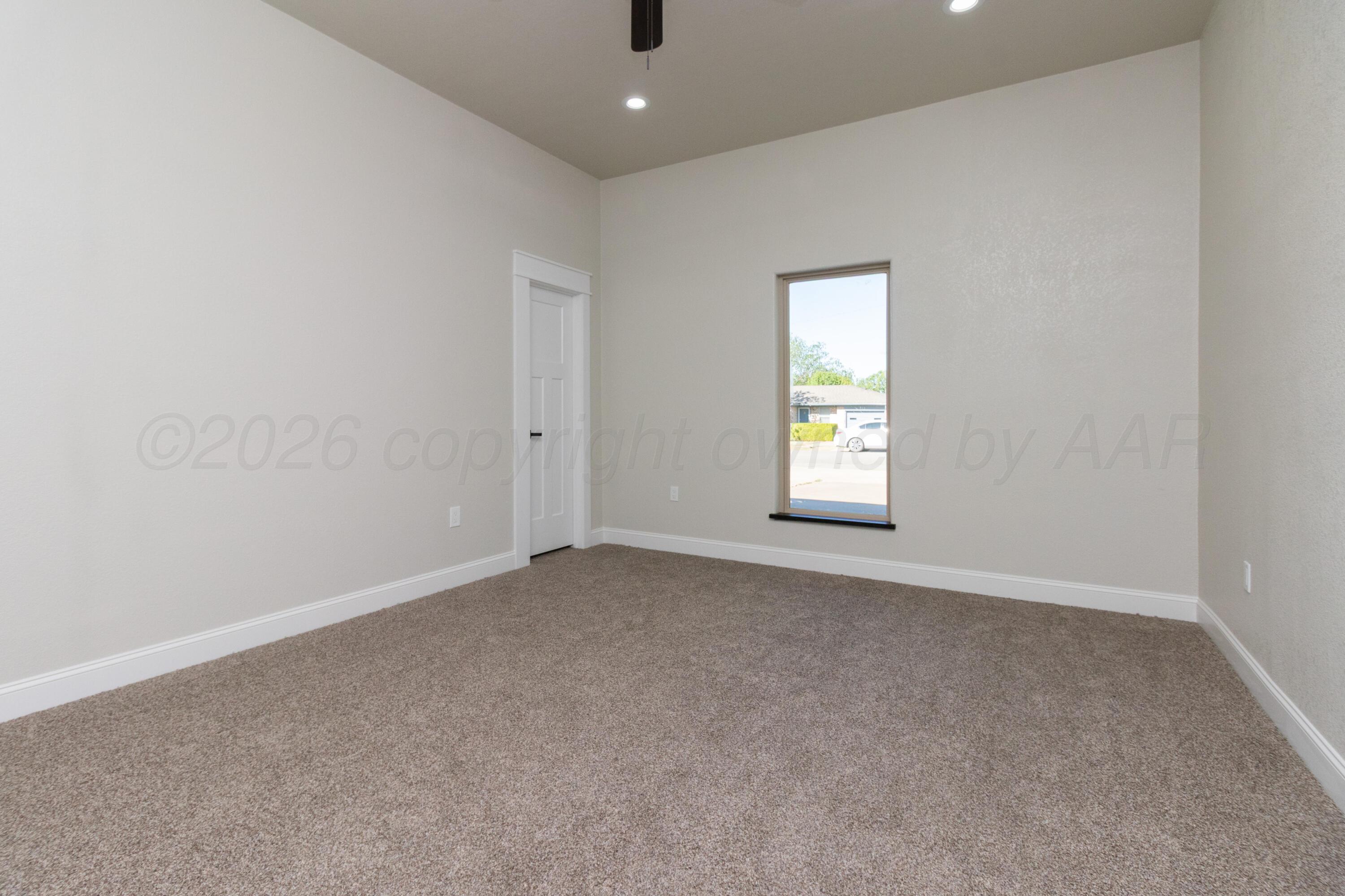 810 South Houston Street Shamrock, TX 79079 - Photo 14 of 42 an empty room with windows and closet
