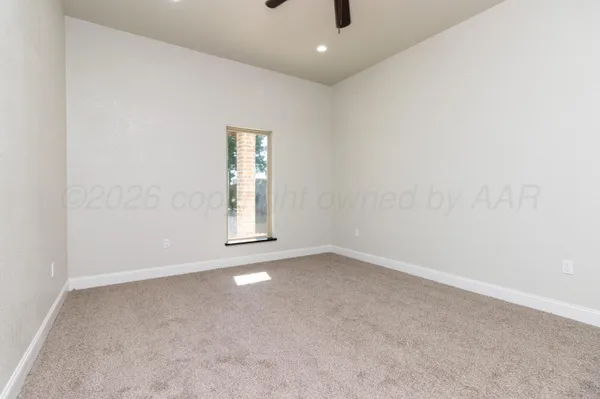 an empty room with a empty space and windows