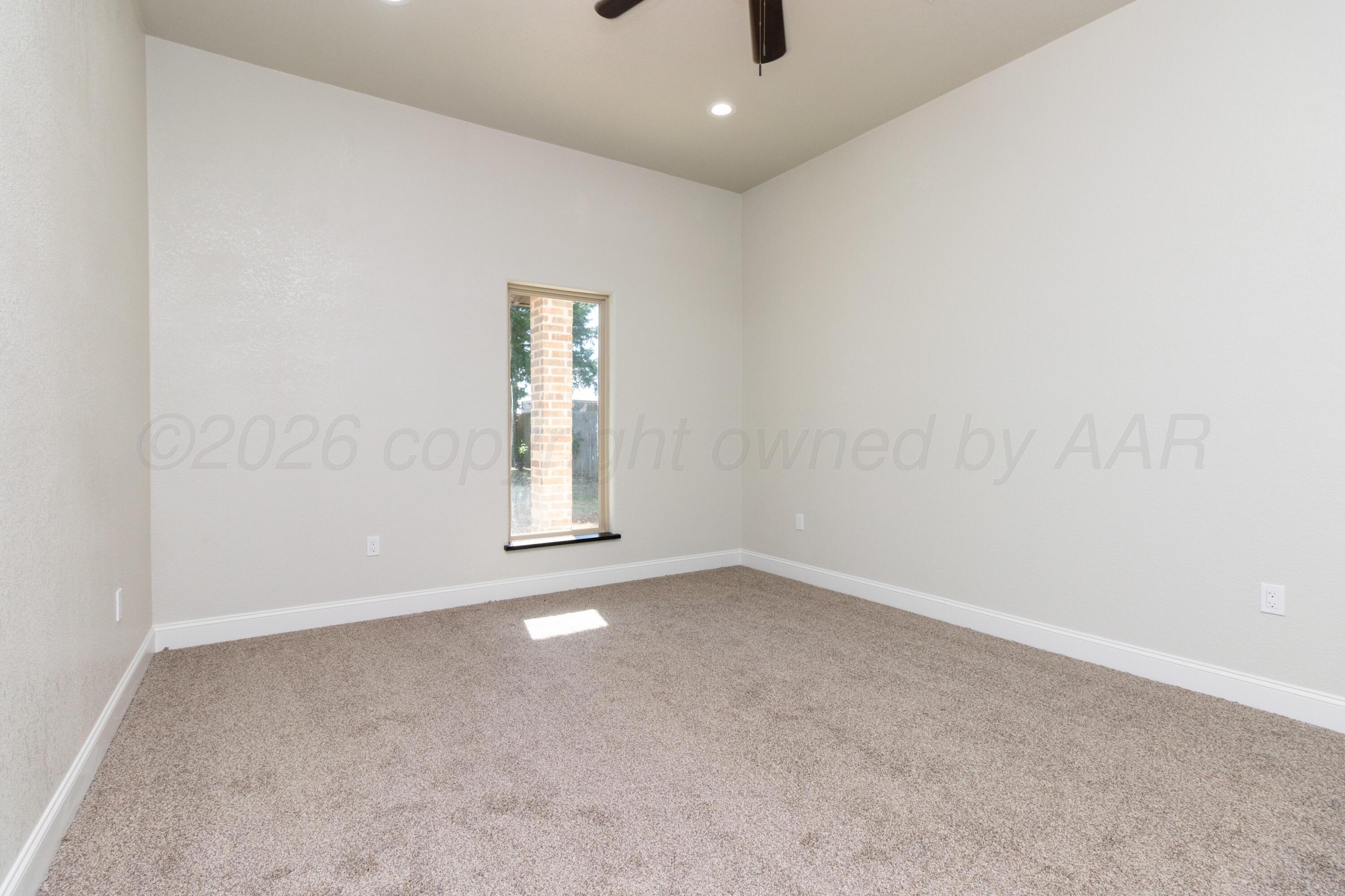 810 South Houston Street Shamrock, TX 79079 - Photo 17 of 42 an empty room with a empty space and windows