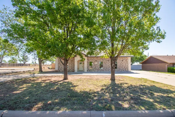 a house with trees in front of it