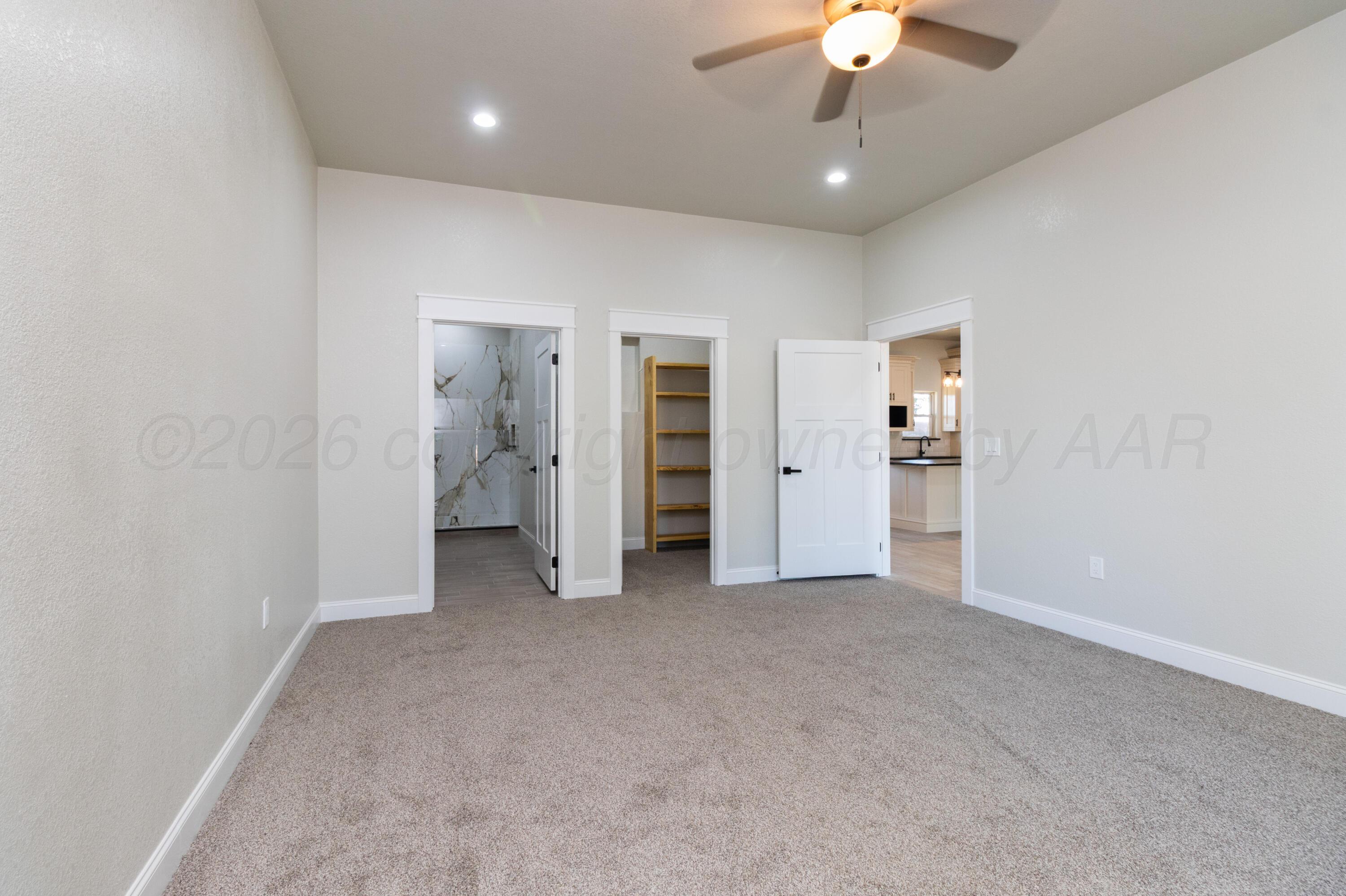 810 South Houston Street Shamrock, TX 79079 - Photo 23 of 42 wooden floor in an empty room with a bathroom