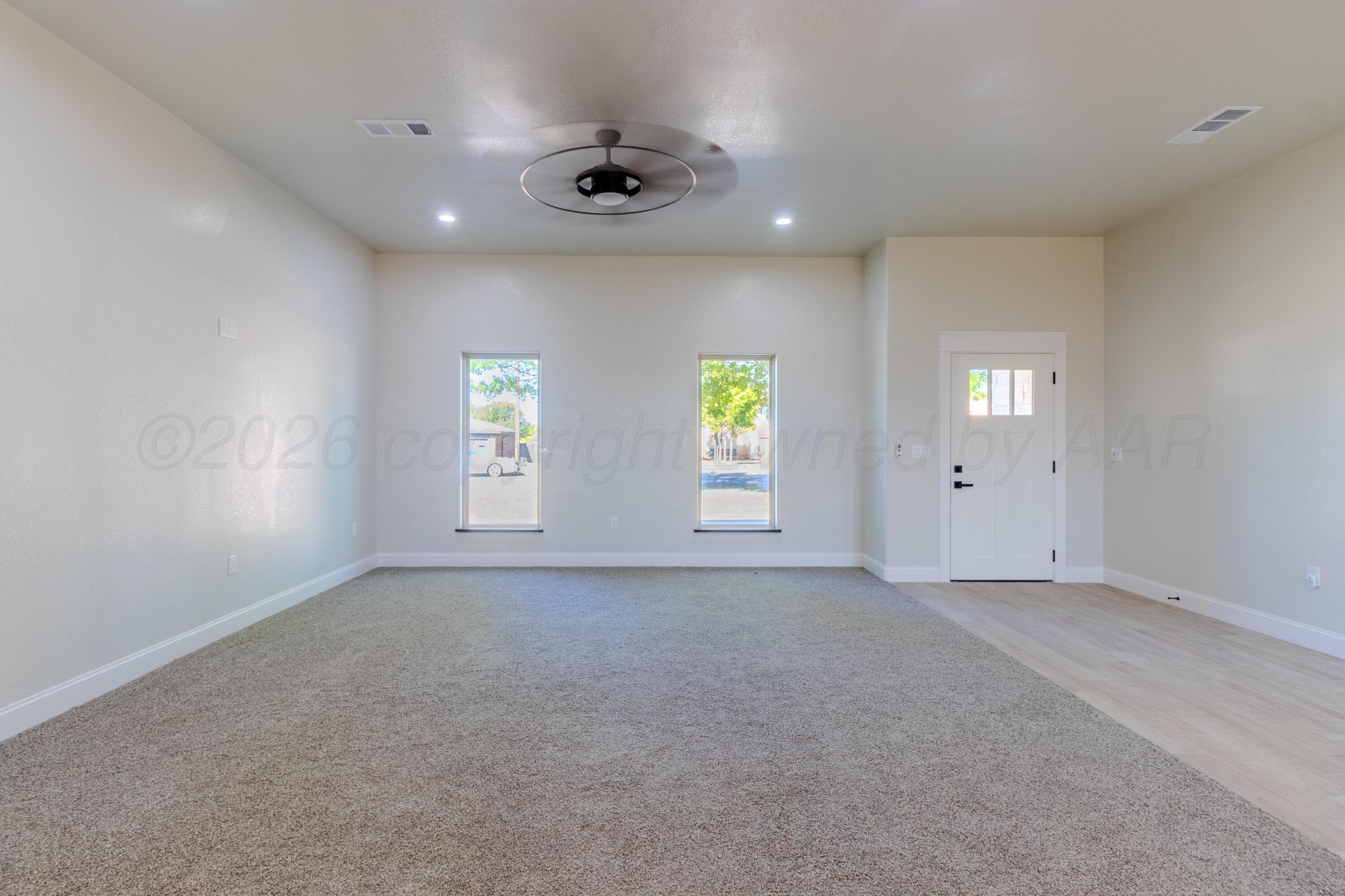 810 South Houston Street Shamrock, TX 79079 - Photo 10 of 42 an empty room with windows and closet