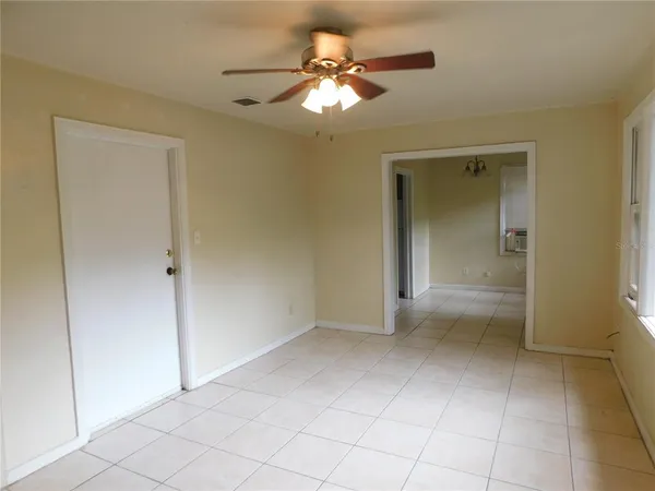 a view of a livingroom with a chandelier fan