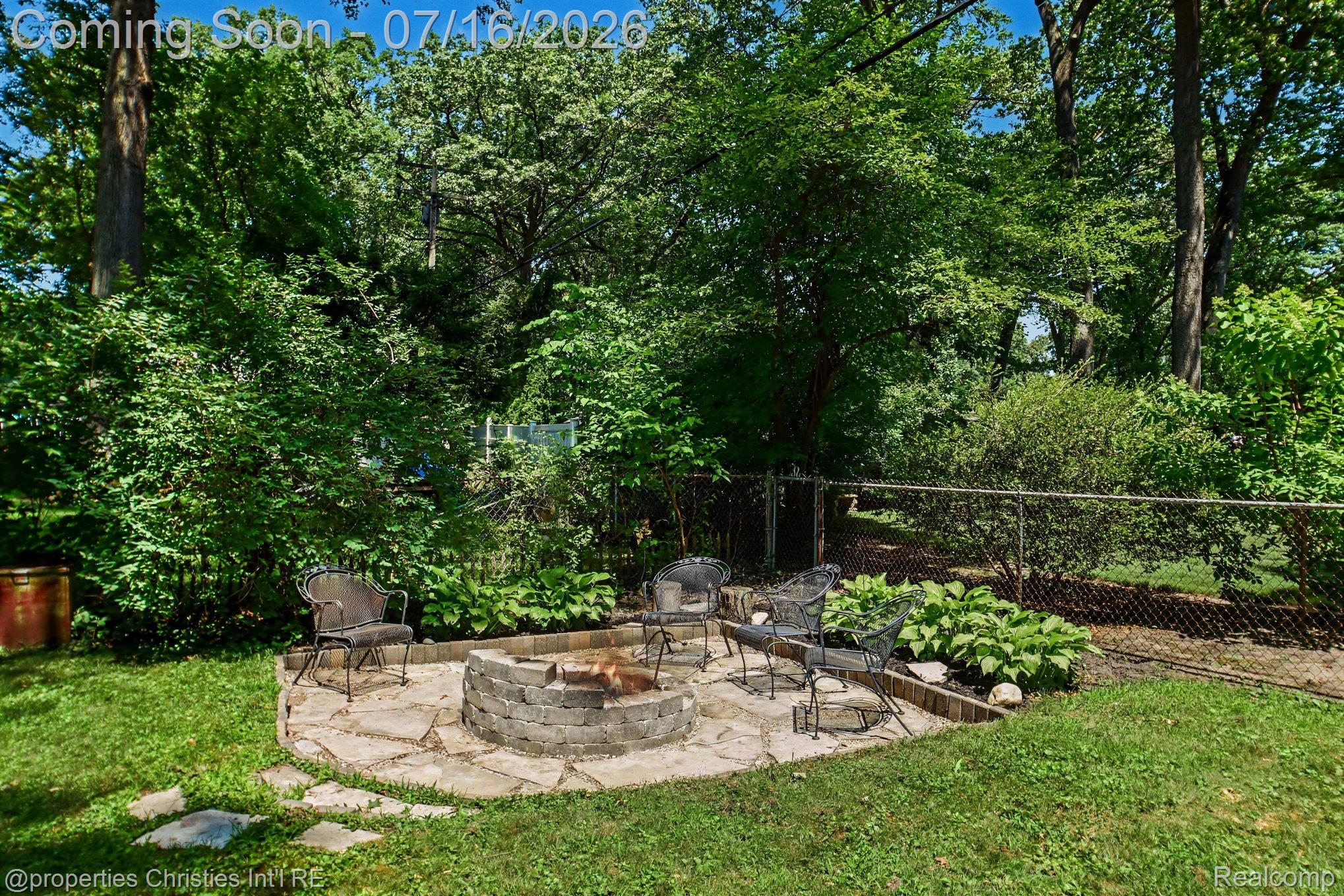 3304 Riverside Drive Port Huron, MI 48060 - Photo 23 of 26 Stone fire pit surrounded by a flagstone patio