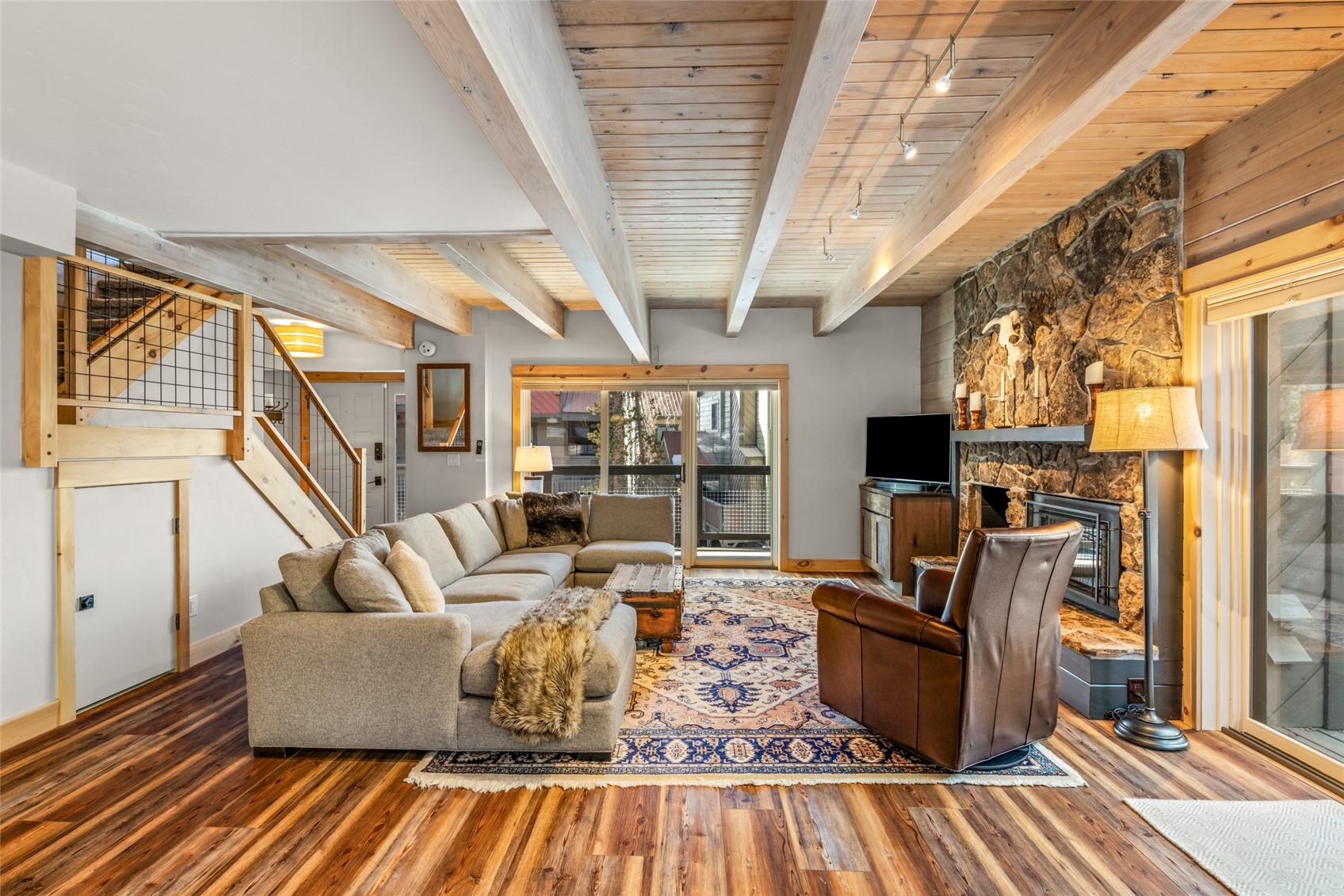 2650 Medicine Springs Road, Unit 11 Steamboat Springs, CO 80487 - Photo 1 of 40 a living room with furniture fireplace and a flat screen tv