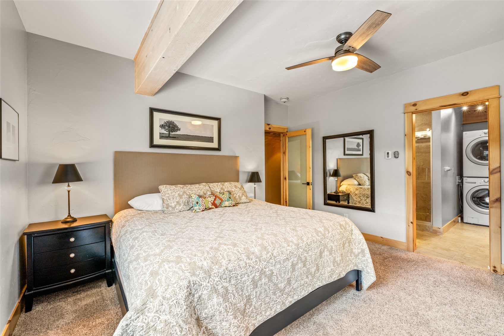 2650 Medicine Springs Road, Unit 11 Steamboat Springs, CO 80487 - Photo 16 of 40 a bedroom with a bed and a chandelier