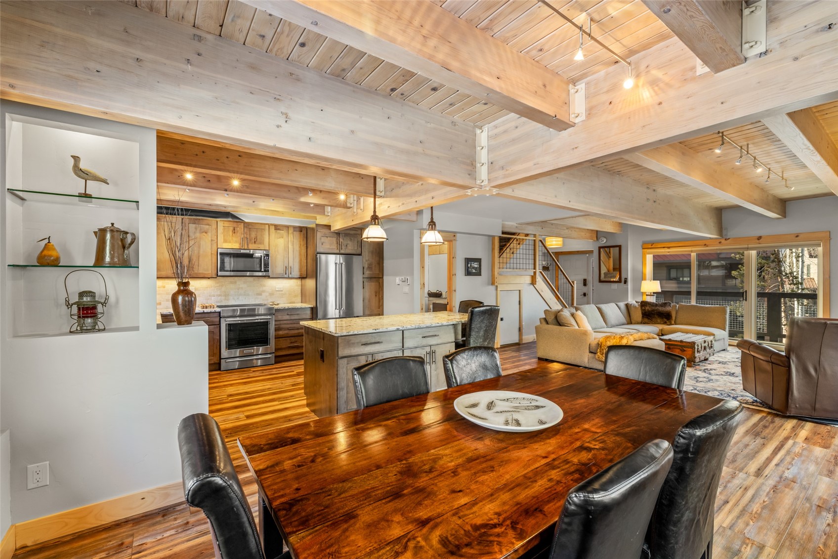2650 Medicine Springs Road, Unit 11 Steamboat Springs, CO 80487 - Photo 2 of 40 a view of a dining room with furniture and wooden floor