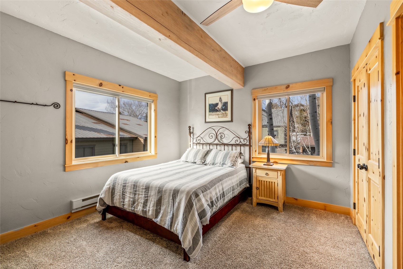 2650 Medicine Springs Road, Unit 11 Steamboat Springs, CO 80487 - Photo 24 of 40 a bedroom with a bed and a window