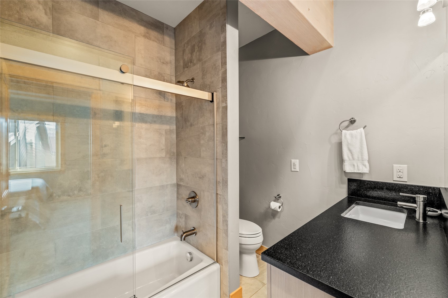 2650 Medicine Springs Road, Unit 11 Steamboat Springs, CO 80487 - Photo 26 of 40 a bathroom with a sink a toilet and shower