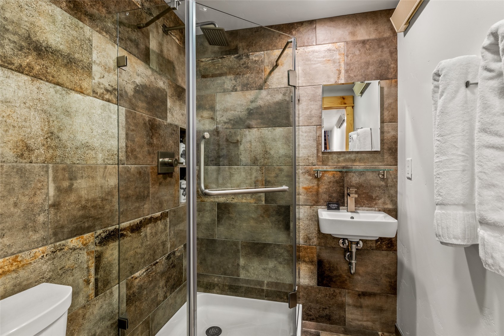 2650 Medicine Springs Road, Unit 11 Steamboat Springs, CO 80487 - Photo 29 of 40 a bathroom with a shower and toilet