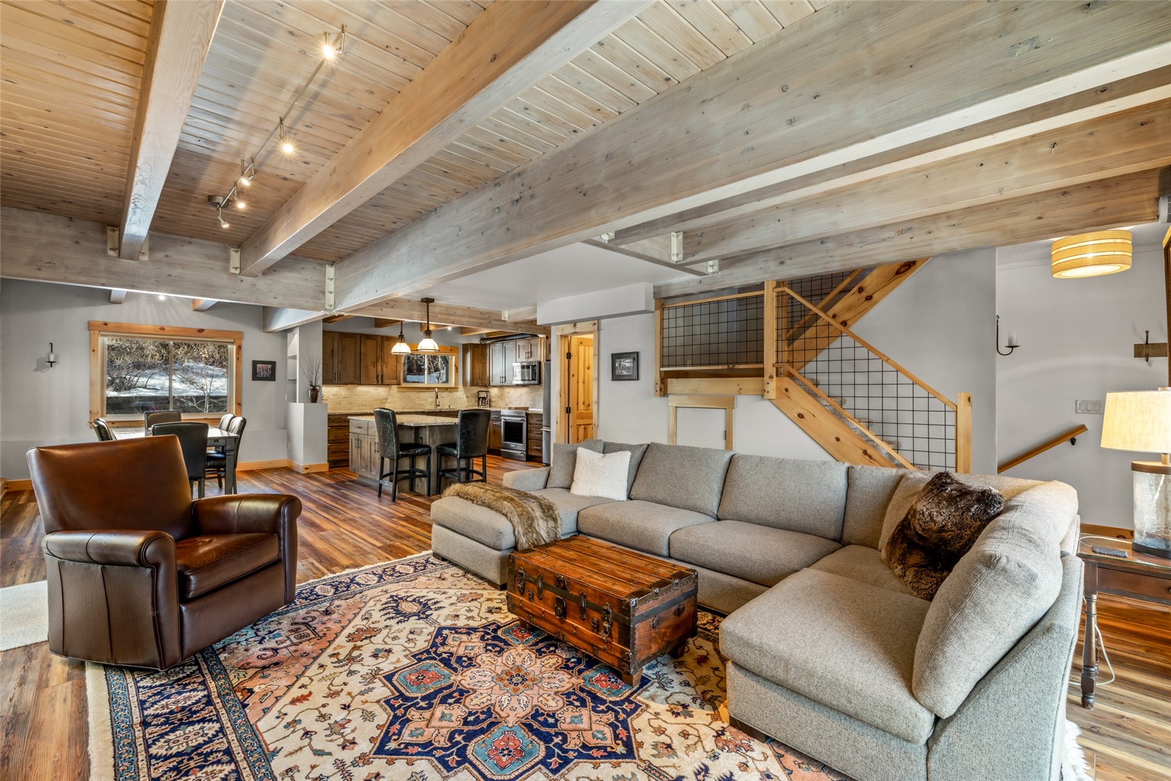 2650 Medicine Springs Road, Unit 11 Steamboat Springs, CO 80487 - Photo 8 of 40 a living room with furniture and wooden floor