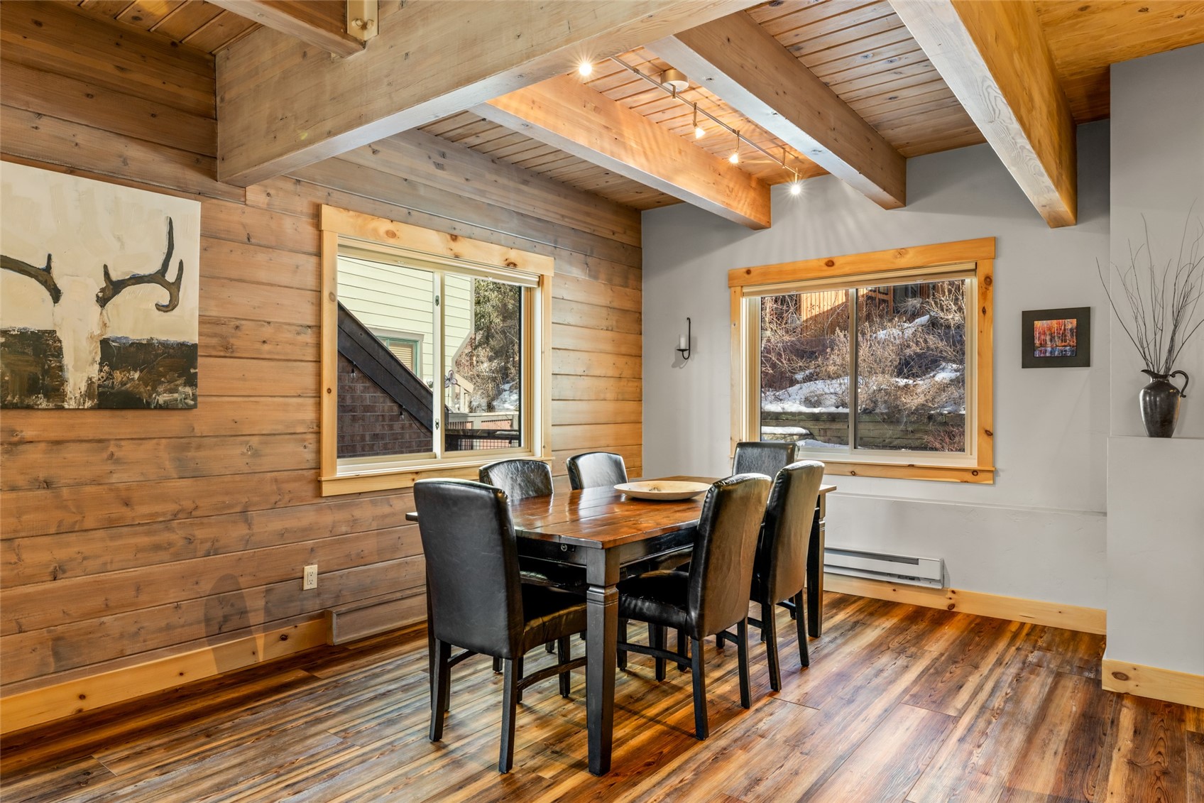 2650 Medicine Springs Road, Unit 11 Steamboat Springs, CO 80487 - Photo 9 of 40 a dining room with furniture and wooden floor