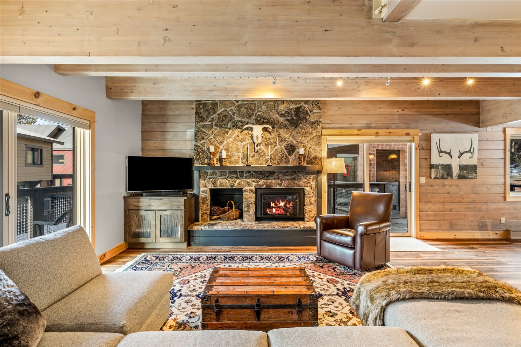 2650 Medicine Springs Road, Unit 11 Steamboat Springs, CO 80487 - Photo 10 of 40 a living room with furniture and a flat screen tv