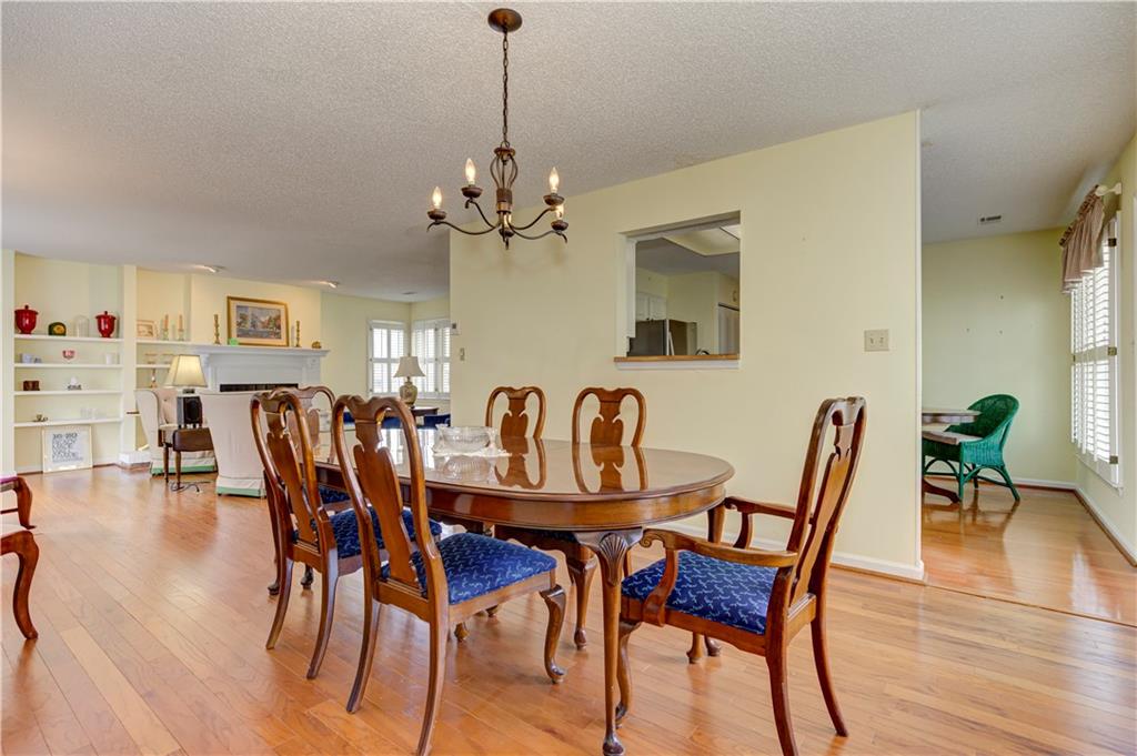 94 Robyn Way Marietta, GA 30062 - Photo 14 of 40 a view of a dining room with furniture and wooden floor