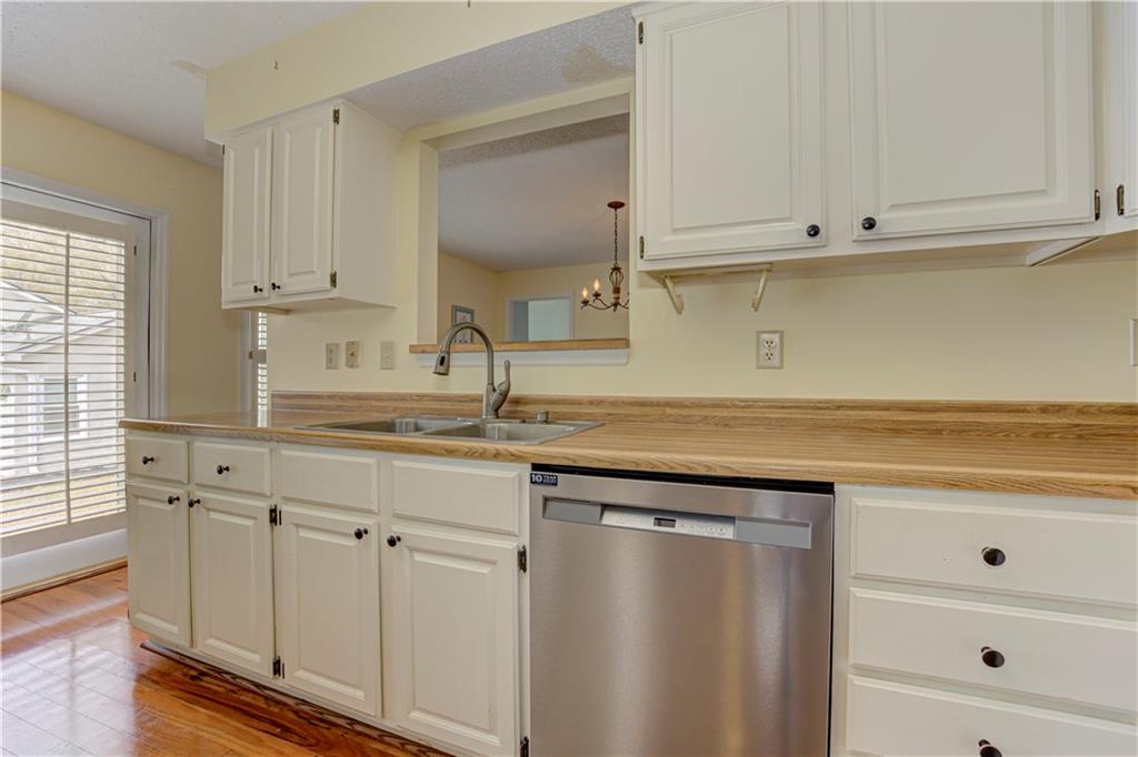 94 Robyn Way Marietta, GA 30062 - Photo 19 of 40 a kitchen with white cabinets and sink