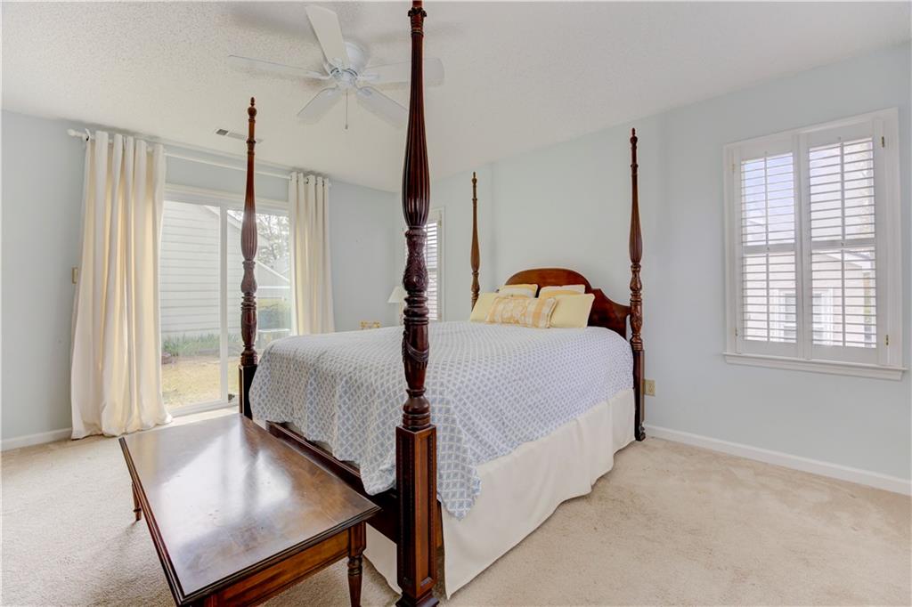 94 Robyn Way Marietta, GA 30062 - Photo 23 of 40 a bedroom with a bed window and walk in closet
