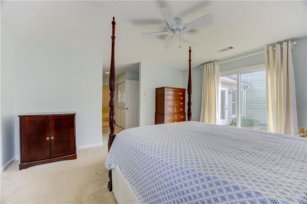 94 Robyn Way Marietta, GA 30062 - Photo 25 of 40 a bedroom with a bed and a dresser