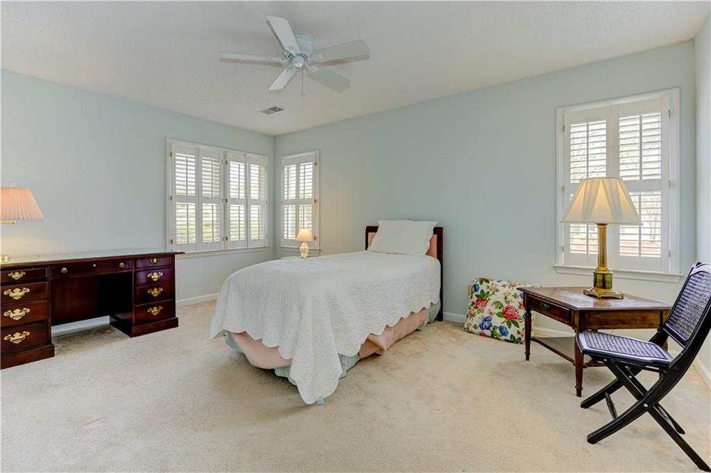 94 Robyn Way Marietta, GA 30062 - Photo 29 of 40 a bedroom with a bed and a window