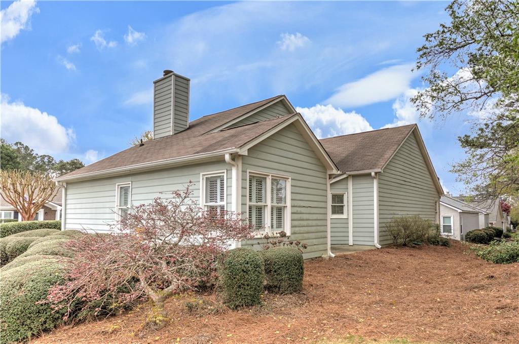 94 Robyn Way Marietta, GA 30062 - Photo 34 of 40 a front view of a house with garden