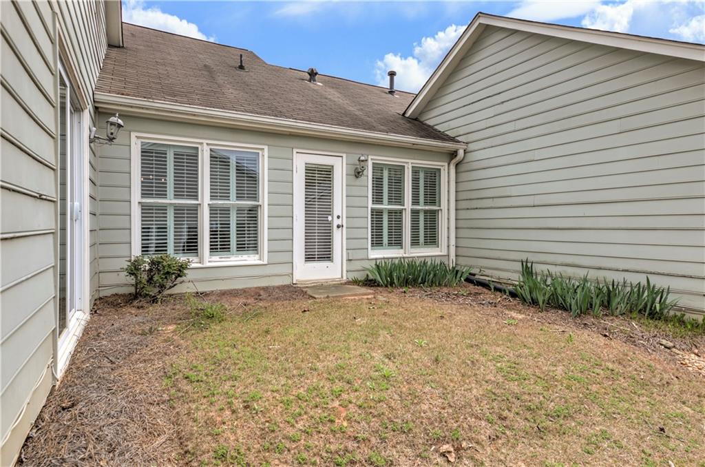 94 Robyn Way Marietta, GA 30062 - Photo 35 of 40 a front view of a house with garden