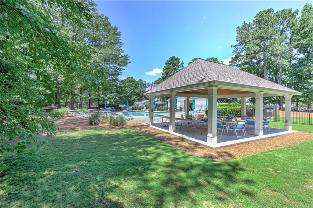 94 Robyn Way Marietta, GA 30062 - Photo 39 of 40 a view of a house with a yard and sitting area